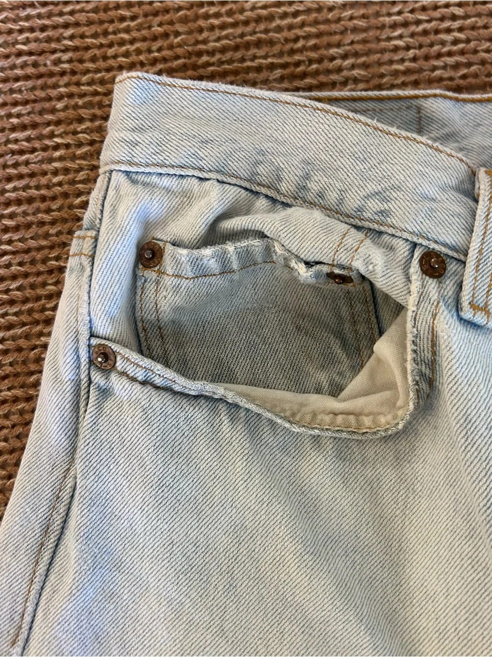 Vintage 1993 men's Levi's 501 light blue denim jeans with leather patch 38×34